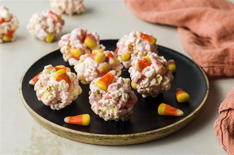 candy-corn-popcorn-balls-recipe-the-spruce-eats image
