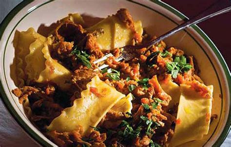 braised-rabbit-sauce-with-pappardelle-noodles-edible image