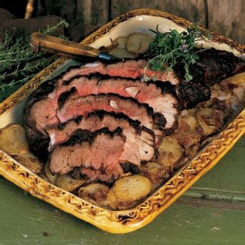 roast-leg-of-lamb-with-potatoes-and-onions-epicurious image