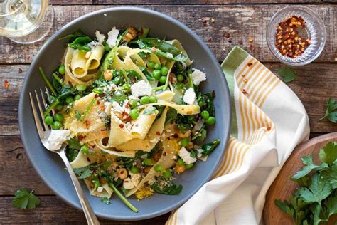 pappardelle-with-wilted-greens-hazelnuts-and-ricotta image