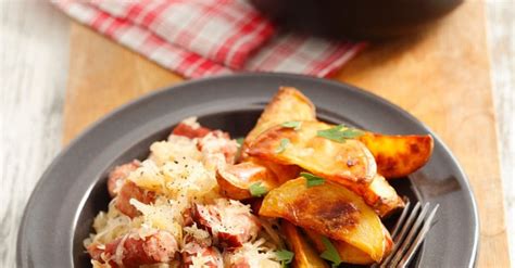 hearty-sauerkraut-sausage-stew-with-baked-potatoes image