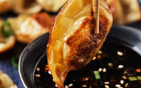 pork-potstickers-with-honey-soy-dipping-sauce image