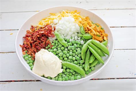 easy-green-pea-salad-with-bacon-nelliebellie image