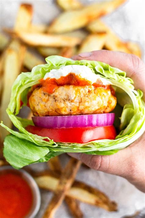 buffalo-chicken-burgers-with-healthy-blue-cheese-dressing image