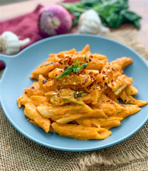 pasta-in-roasted-carrot-red-pepper-sauce image
