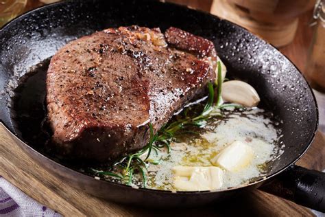 pan-seared-butter-basted-rosemary-steak-the-daily-meal image