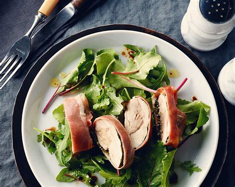 prosciutto-basil-wrapped-chicken-over-greens image