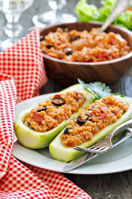 vegan-stuffed-zucchini-with-millet-tomatoes-olives-foodal image