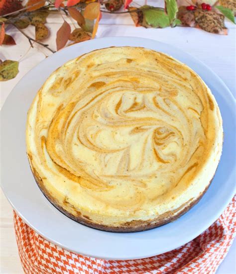 marbled-pumpkin-spice-cheesecake-with-gingersnap-crust image