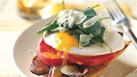 open-face-bacon-and-egg-sandwiches-with-arugula image