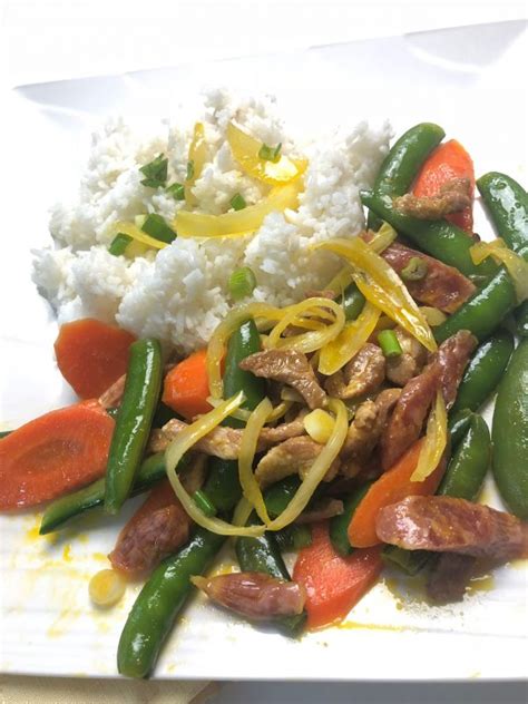 stir-fried-sugar-snap-peas-with-pork-and-chinese-sausages image
