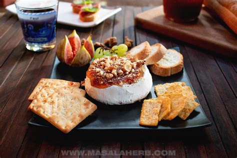 baked-brie-with-fig-jam-and-walnuts-masala-herb image