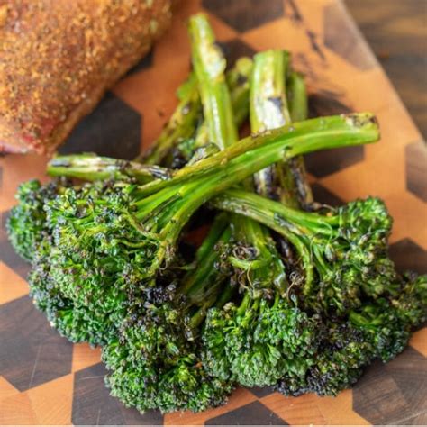 grilled-broccolini-with-lemon-garlic-dressing-hey-grill image