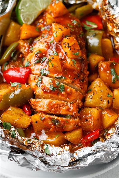 pineapple-bbq-baked-chicken-foil-packets-in-oven image