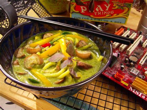 plump-udon-noodles-in-thai-green-curry-with-eggplant image