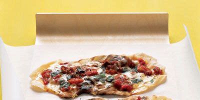 grilled-tomato-pizzettes-with-basil-and-fontina-cheese image