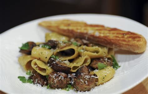 dandelion-pesto-pasta-with-italian-sausage-mushrooms image