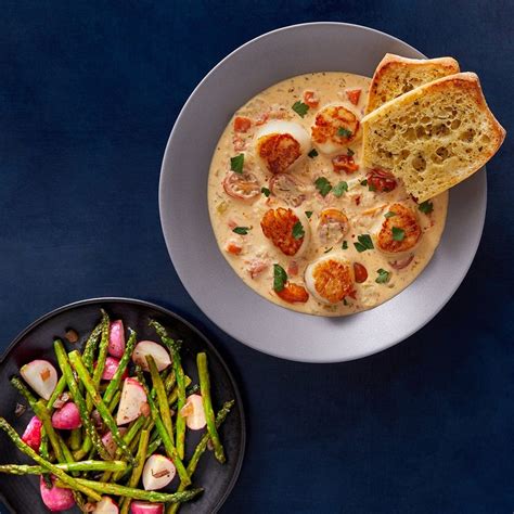 recipe-seared-scallops-in-creamy-tomato-sauce-with-asparagus image