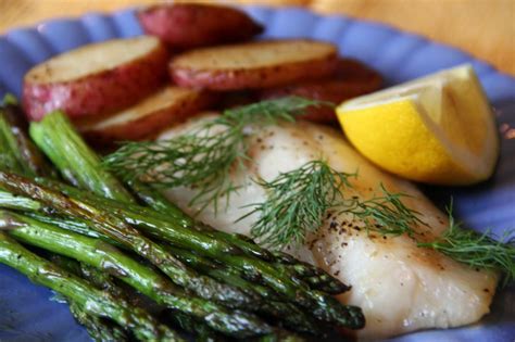 quick-roast-fish-asparagus-and-potatoes-with-lemon image