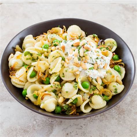 orecchiette-with-peas-pine-nuts-and-ricotta-americas image