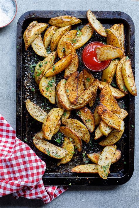 easy-spicy-garlic-baked-potato-wedges-simply-delicious image