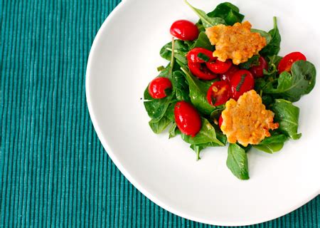 corn-fritters-with-arugula-and-warm-tomato-salad image