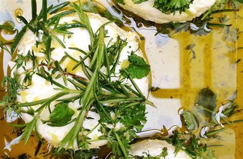 marinated-goat-cheese-with-fresh-herbs-just-a-taste image