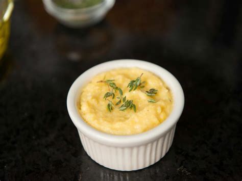 creamy-cheddar-polenta-with-fresh-herbs-cooking image