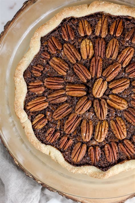chocolate-pecan-pie-with-rum-flour-covered-apron image
