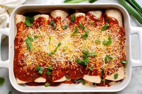 easy-black-bean-chicken-enchiladas-recipe-unpeeled image