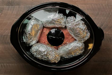 slow-cooker-meatloaf-and-baked-potatoes image