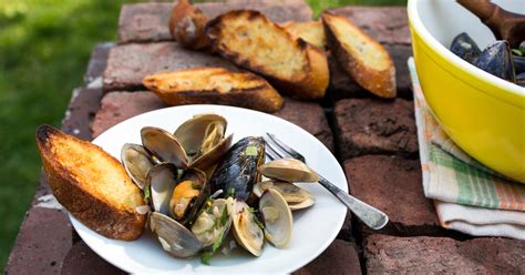 smoky-juicy-mussels-and-clams-pop-on-the-grill image