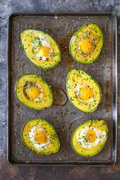baked-eggs-in-avocado-damn-delicious image