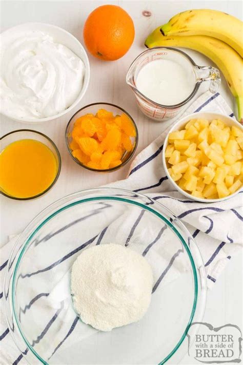 orange-cream-fruit-salad-butter-with-a-side-of-bread image