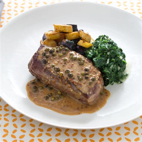 pan-seared-steaks-with-green-peppercorn-sauce image