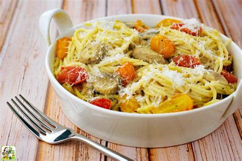 crab-pasta-recipe-with-pesto-mushrooms-tomatoes image
