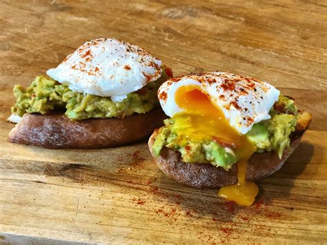 smashed-avocado-with-poached-eggs-the-delectable image