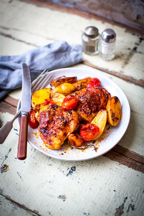harissa-chicken-with-potatoes-tomatoes-thyme image