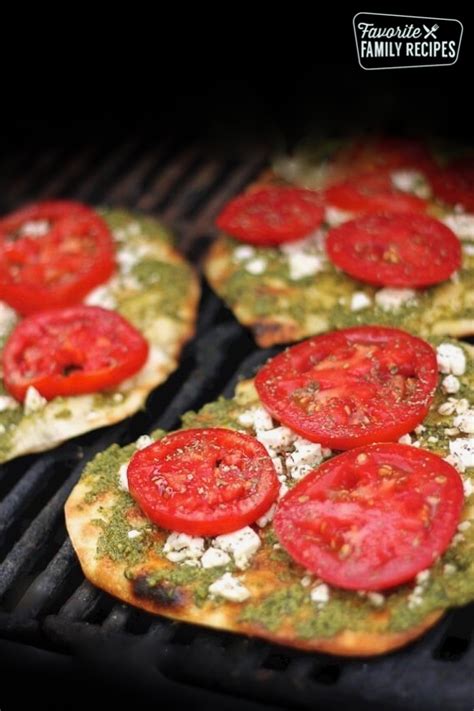 grilled-pesto-pizzas-with-tomatoes-and-feta-with-video image