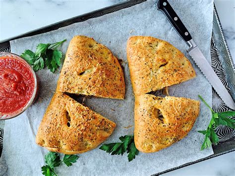sausage-and-pepper-calzones-culinaire-magazine image