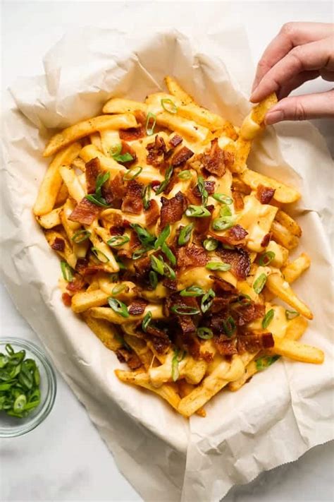 baked-cajun-fries-with-cheese-sauce-joyous-apron image