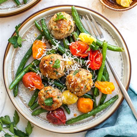 turkey-meatballs-with-green-beans-cherry-tomatoes image