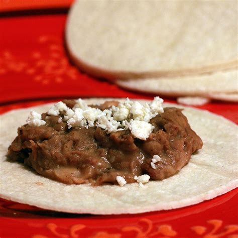 spicy-smoky-bacony-slow-cooker-refried-beans image