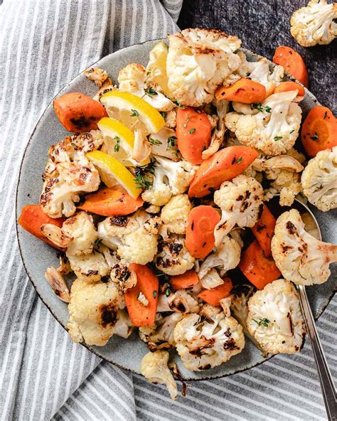 oven-roasted-cauliflower-and-carrots-cooking-in image