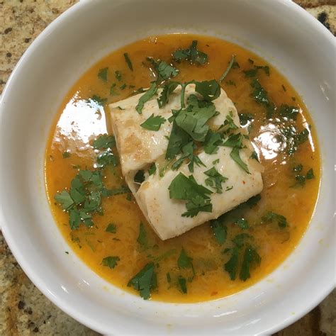 poached-halibut-in-thai-coconut-curry-broth-a-very image