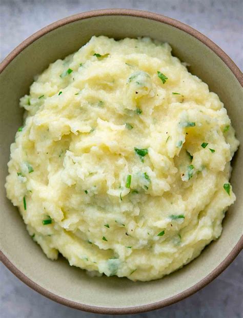 mashed-potatoes-and-parsnips-with-chives-and-parsley image