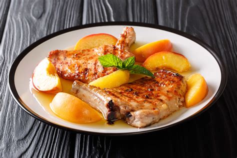peach-and-whiskey-glazed-pork-chops-recipe-bbqchiefs image