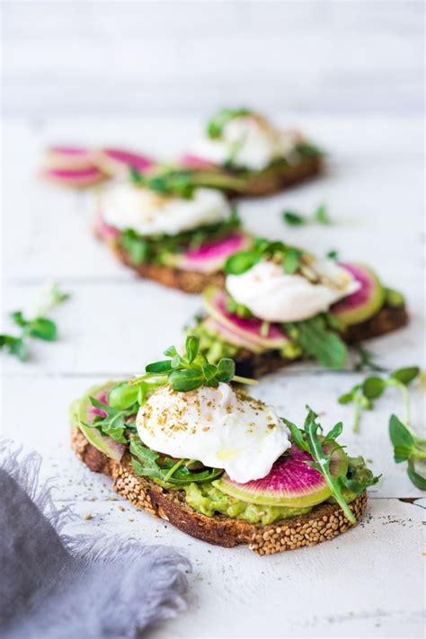 avocado-toast-with-poached-eggs-arugula-and-zaatar image