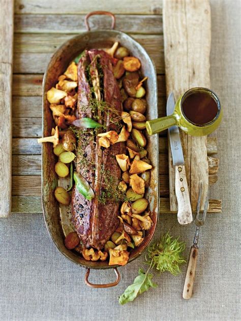roast-saddle-of-venison-with-chanterelles-and-potatoes image