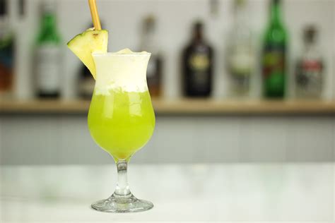 midori-splice-cocktail-recipe-midori-malibu-pineapple image